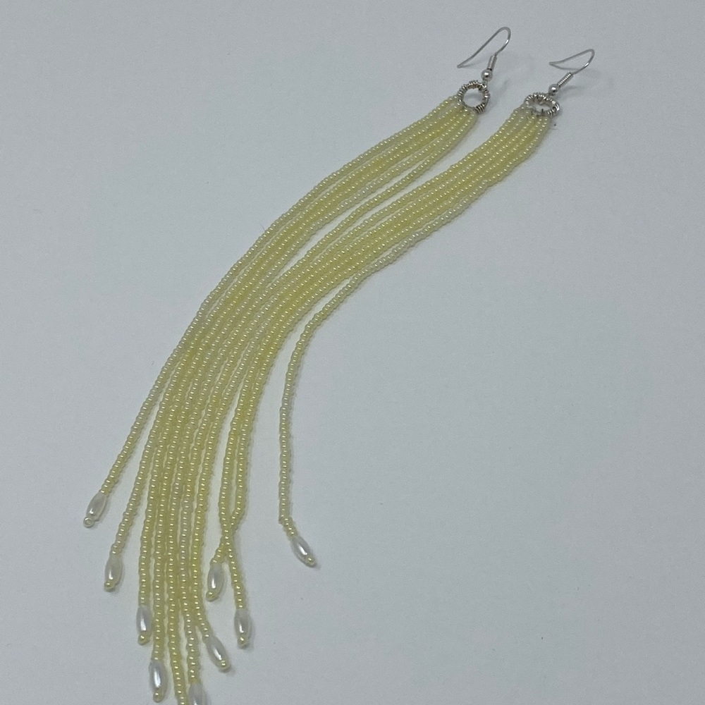 Handmade cream seed bead with white rice bead endings.